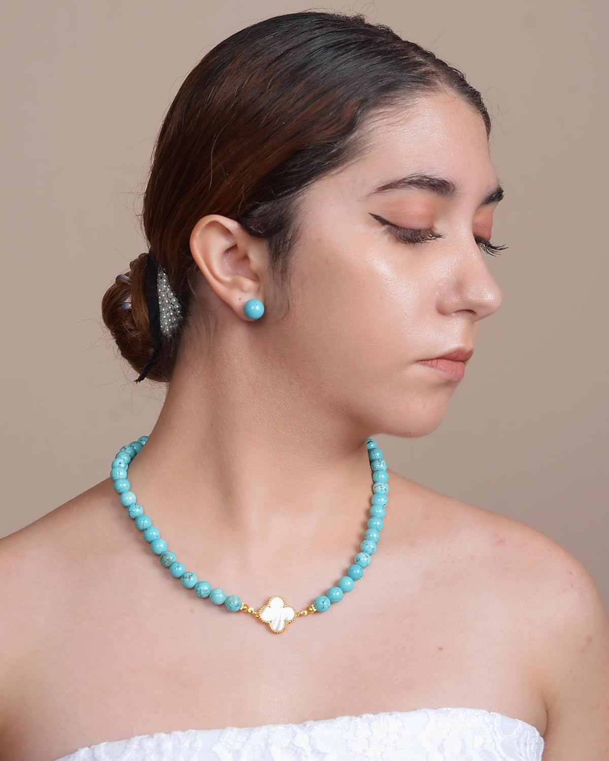 DIVA'S Turquoise 8mm Necklace with Mother Pearl Clover Detail on person with white top