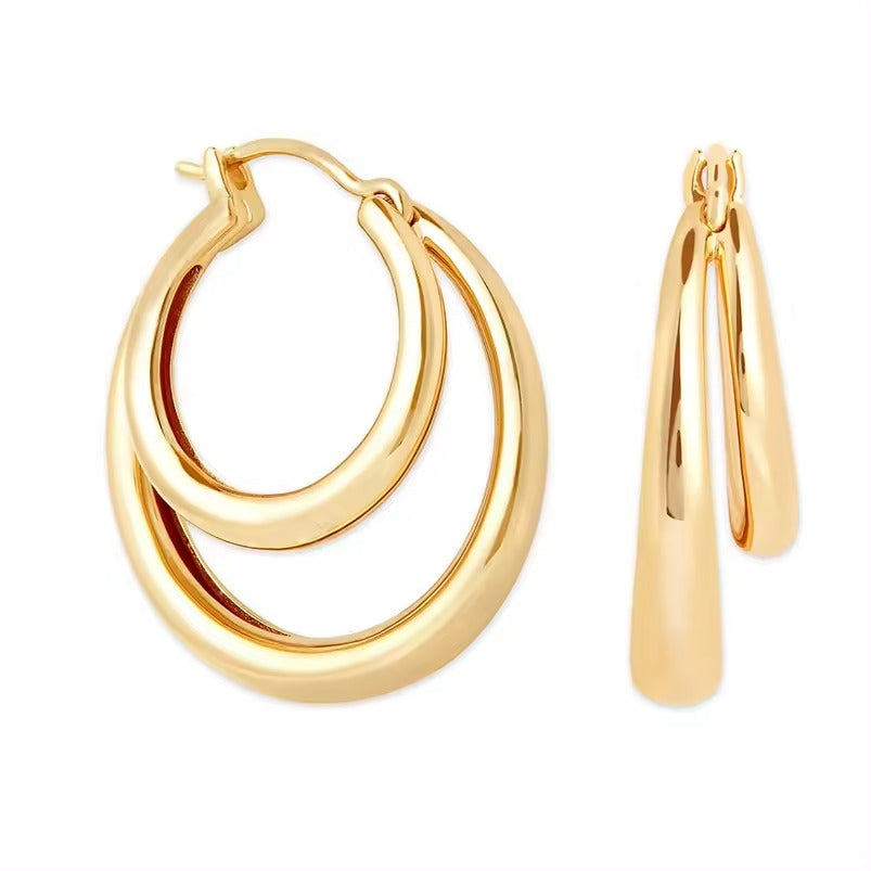double gold hoop style earrings on a white background sterling silver 14k yellow gold plated