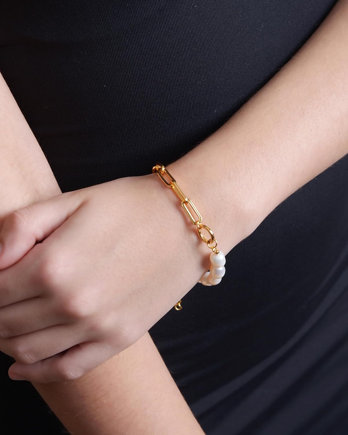 Diva's Women Link Bracelet and Cultured 6.5-7mm Freshwater Pearl Solid 925 Sterling Silver-18kt Gold Plated on person wrist on black background 