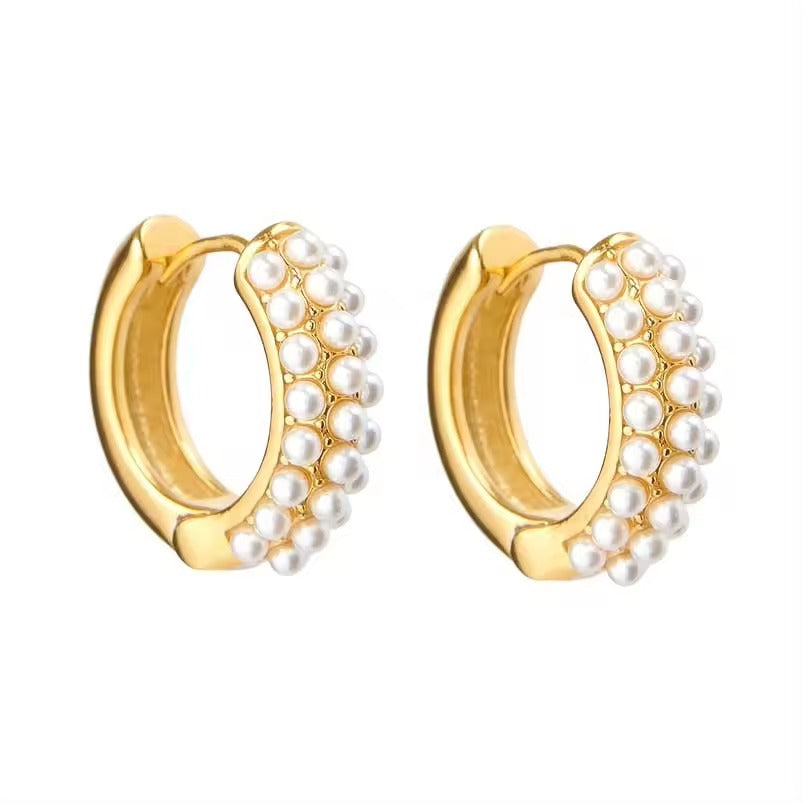 Gold hoop earrings with shell pearl accents on a white background sterling silver 14k gold plated